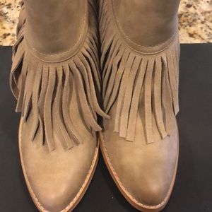 Woman’s fringe ankle boots